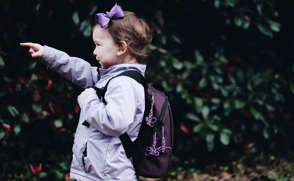 A profile shot of a child wearing The Sprout.